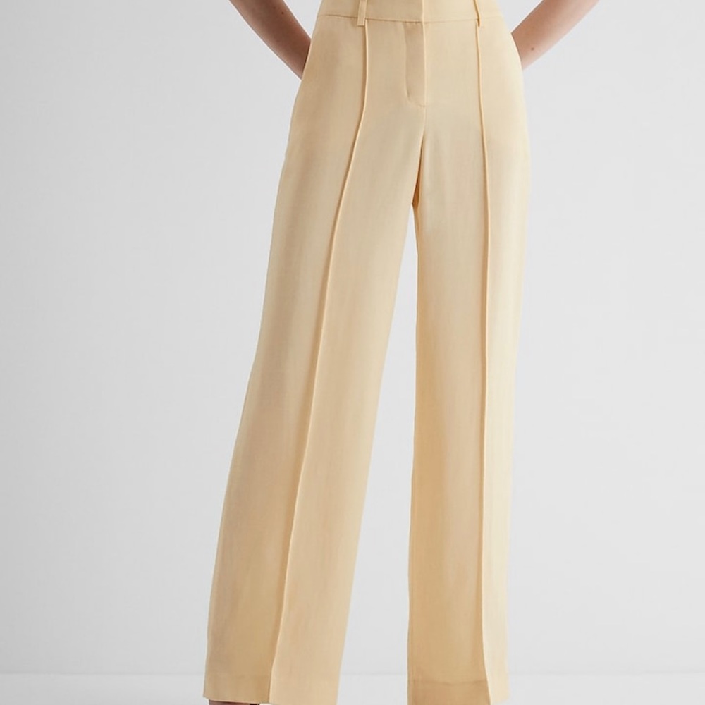 Editor High Waisted Linen-Blend Pintuck Trouser Pant. Color is Pale Yellow.